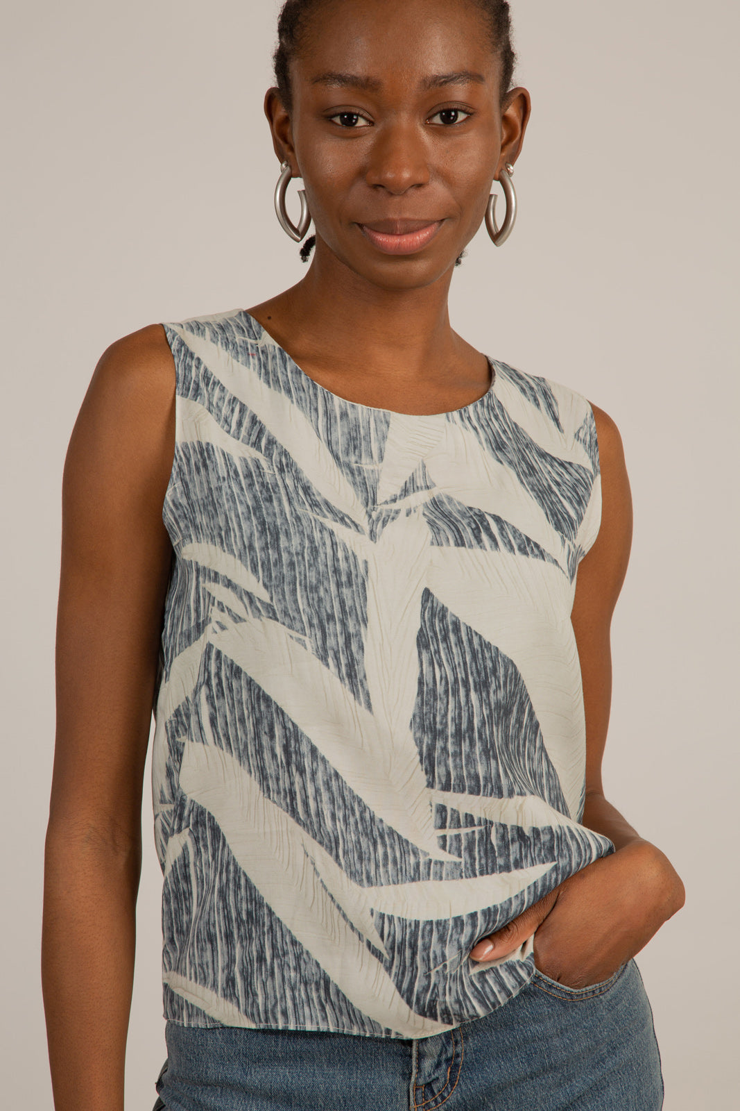 Ivory and black leaves print sleeveless top