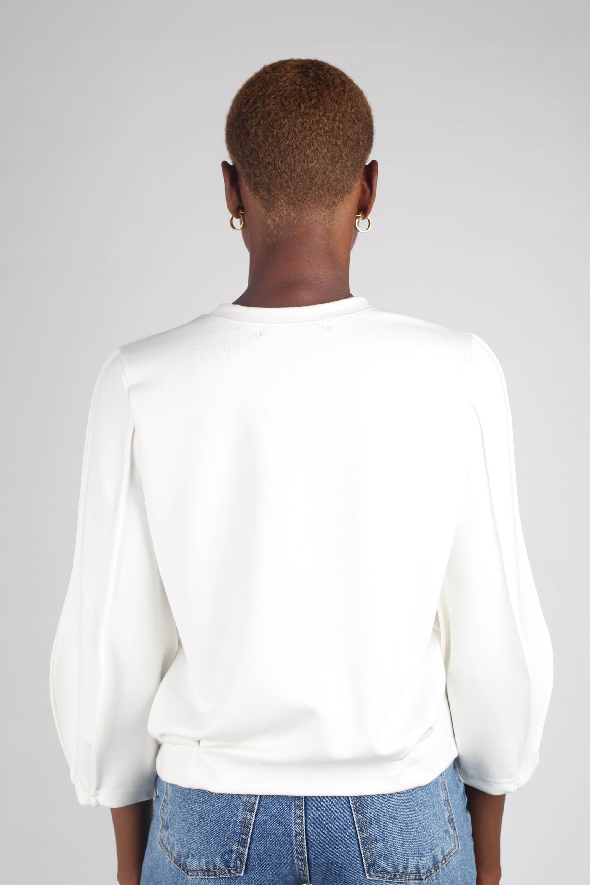 White sharp seamed sleeve top