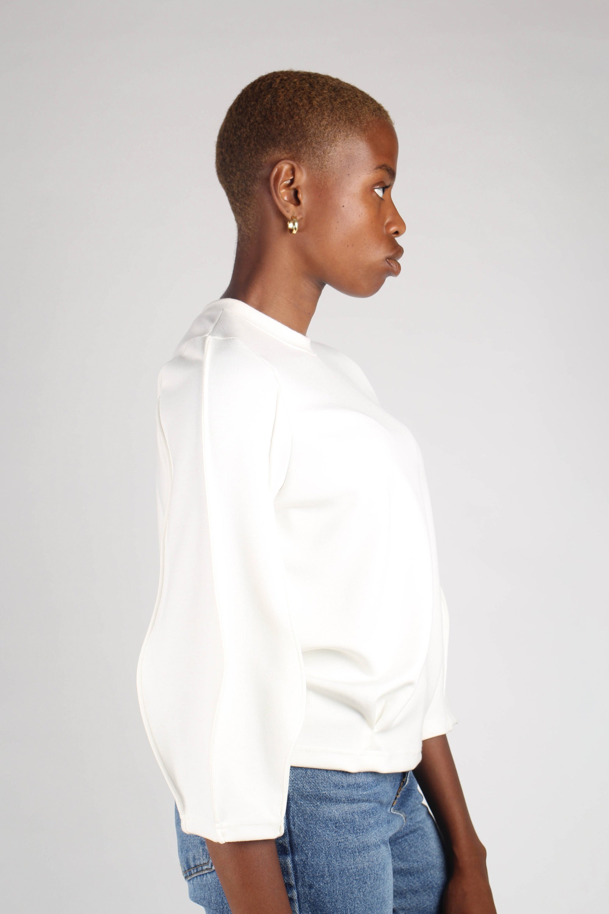 White sharp seamed sleeve top