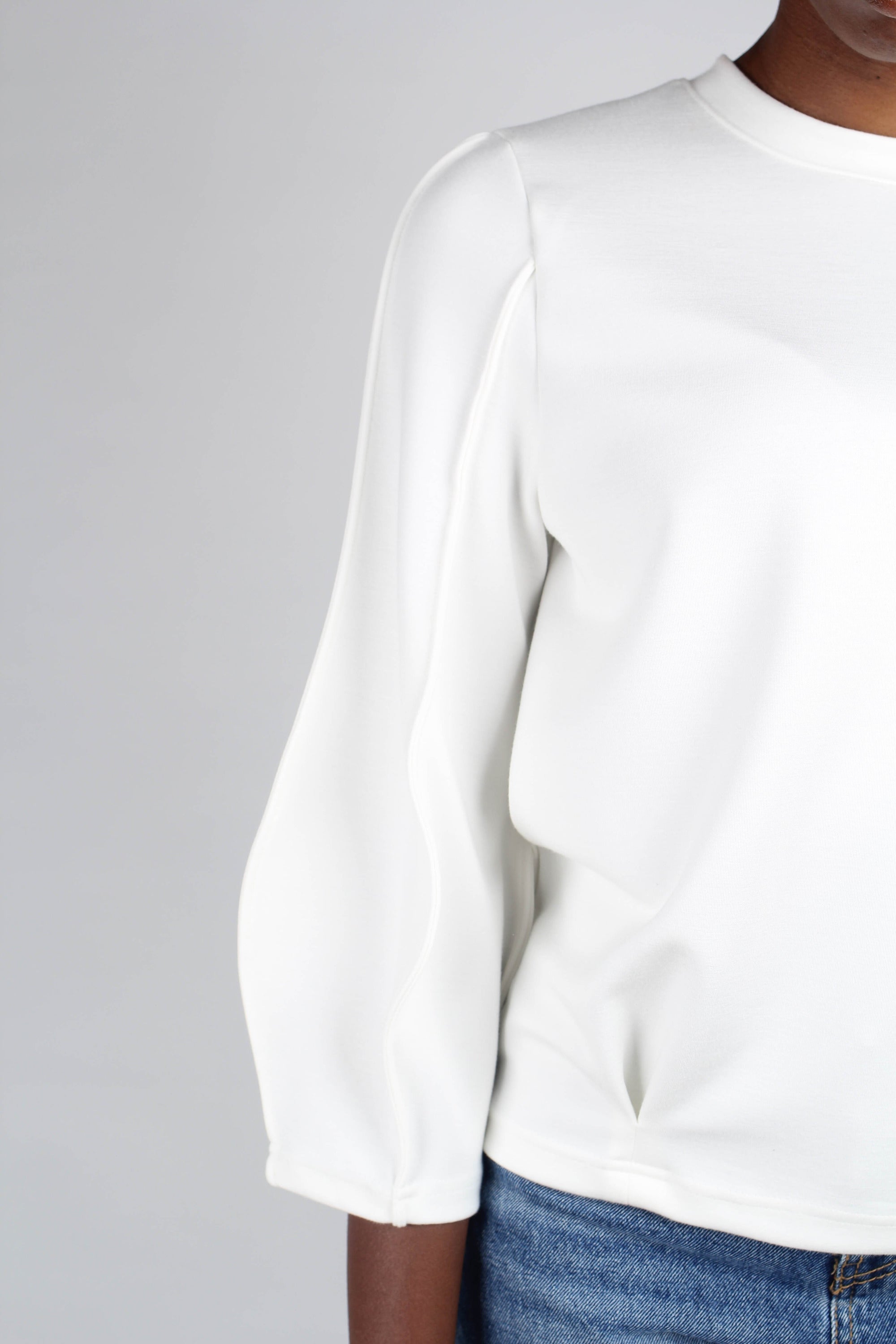 White sharp seamed sleeve top