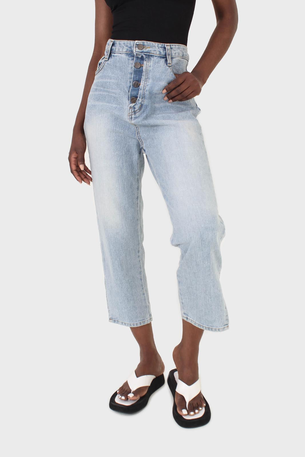 Light blue wash exposed button jeans
