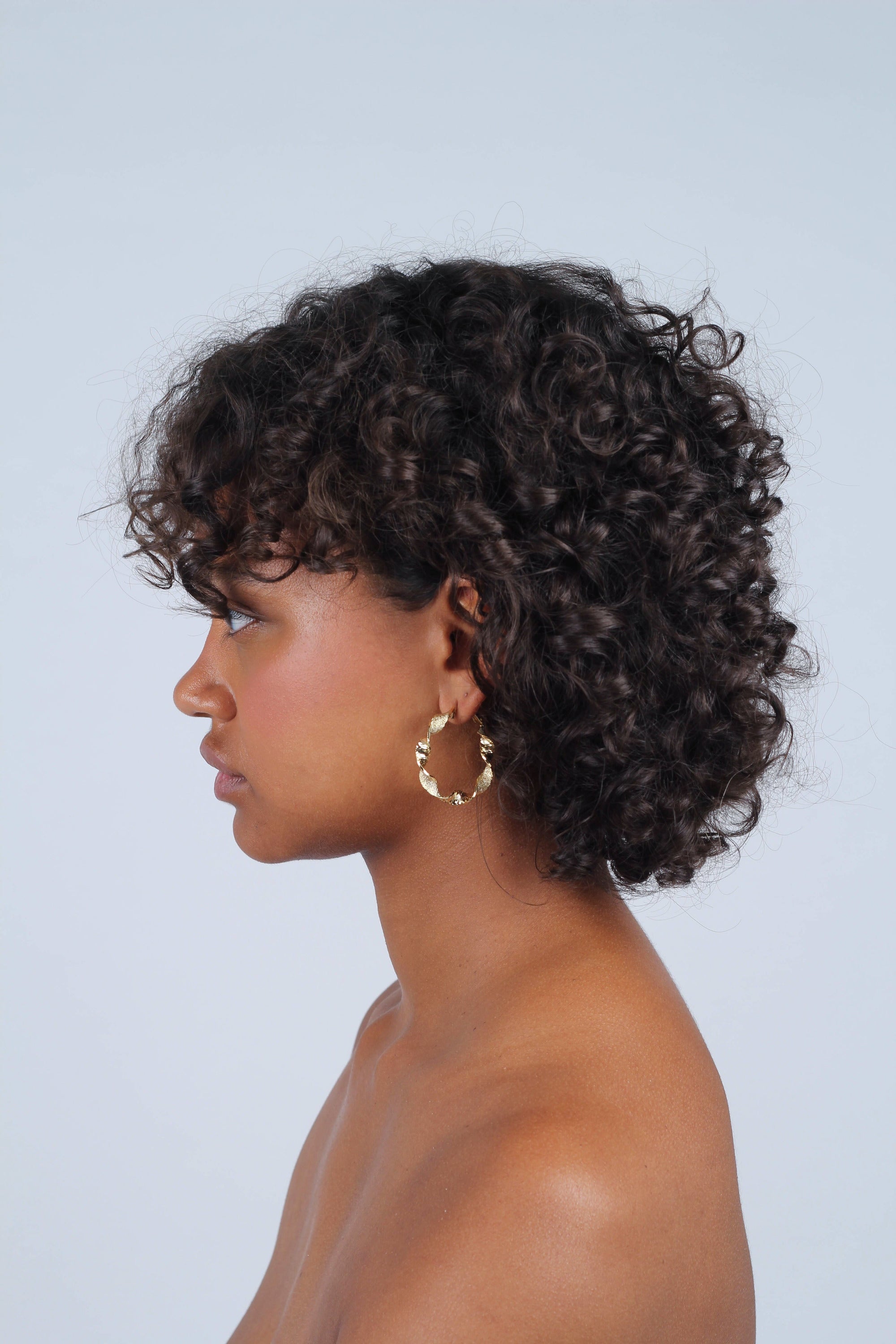 Gold rough smooth twisted hoop earrings