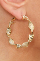 Gold rough smooth twisted hoop earrings