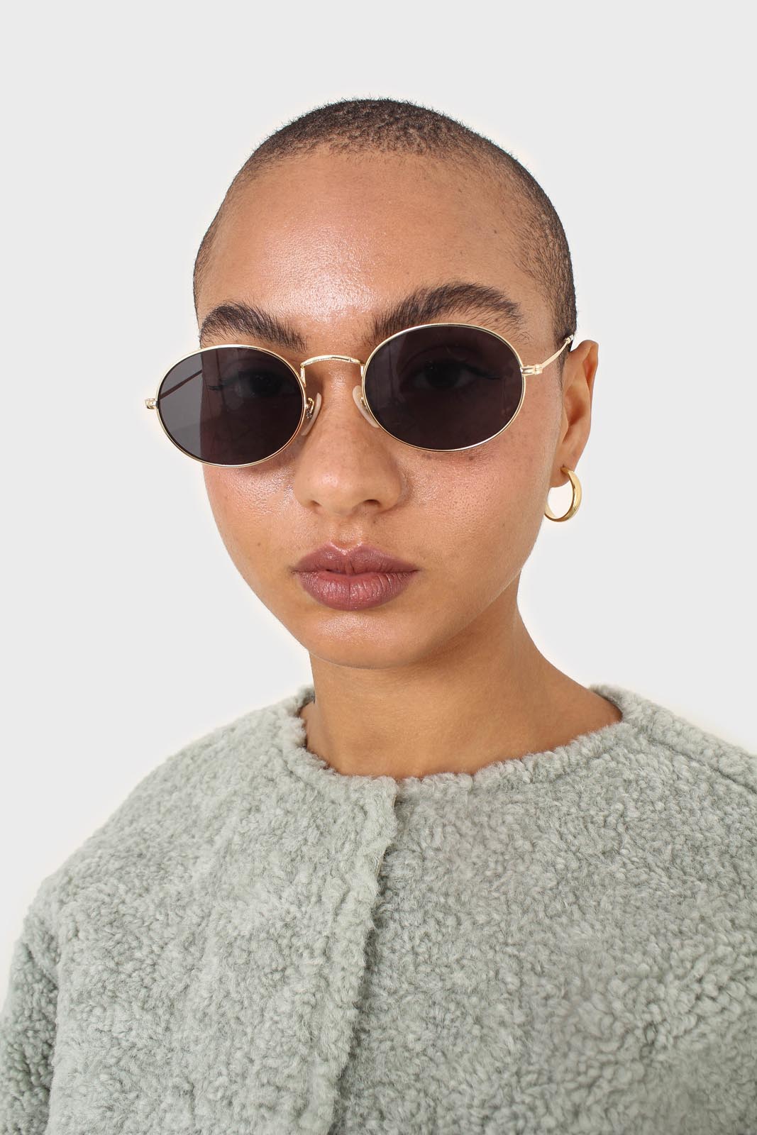 Black gold frame small oval lens sunglasses