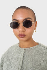 Black gold frame small oval lens sunglasses