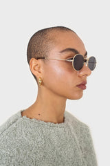 Black gold frame small oval lens sunglasses