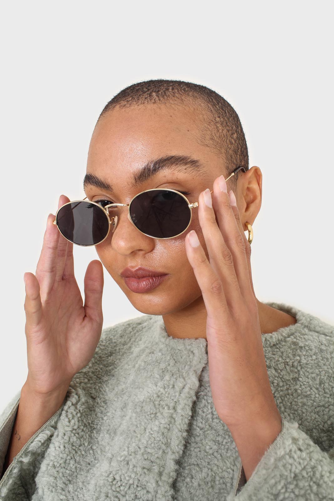 Black gold frame small oval lens sunglasses