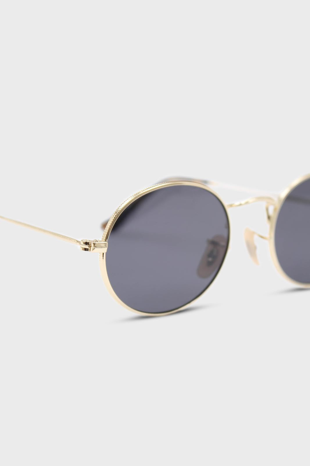 Black gold frame small oval lens sunglasses