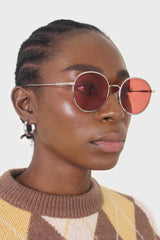 Red and gold lined round sunglasses
