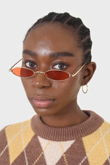 Red and gold lined slim oval sunglasses