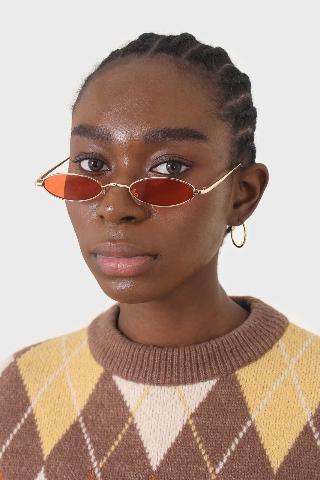 Red and gold lined slim oval sunglasses