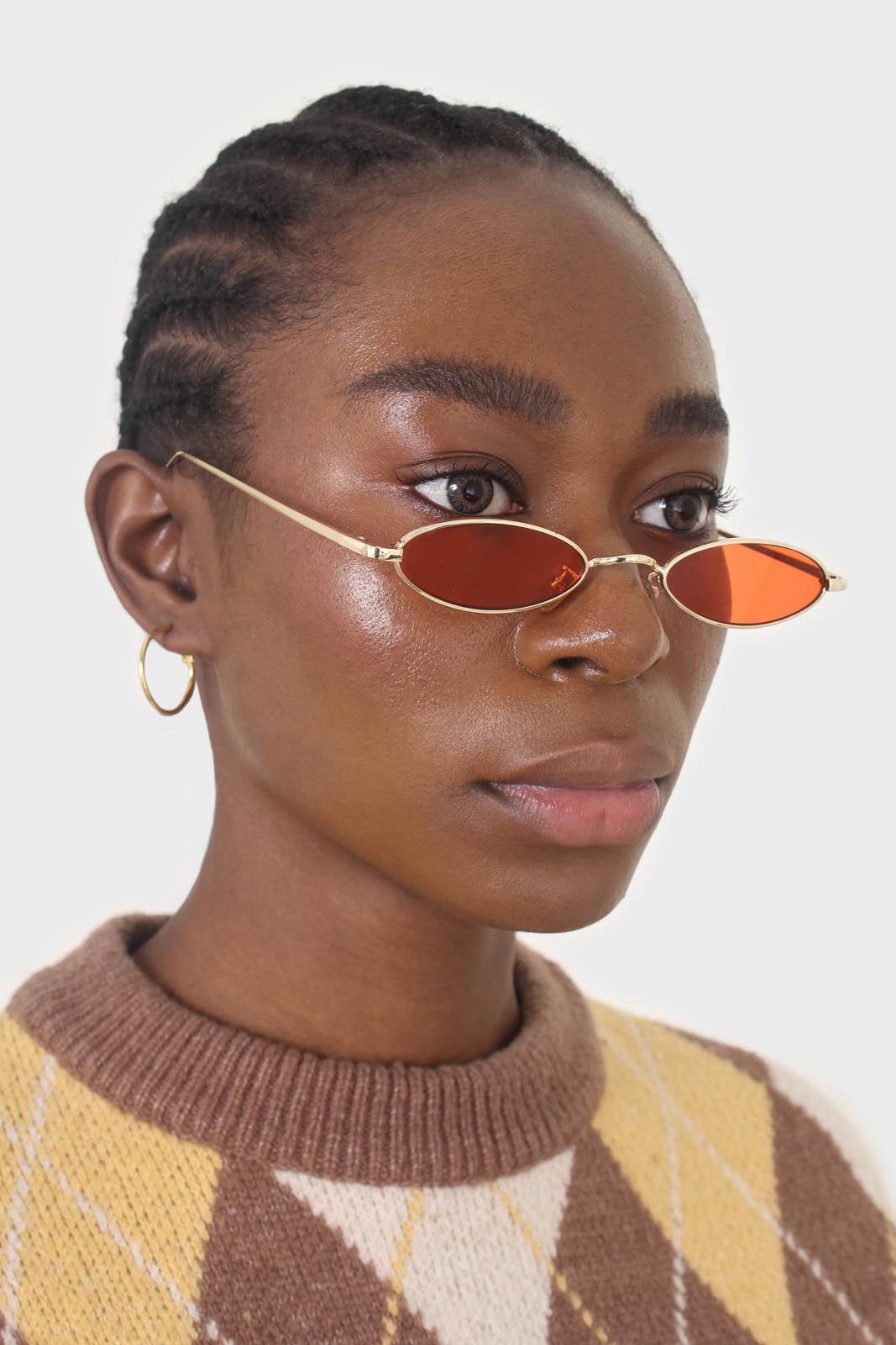 Red and gold lined slim oval sunglasses