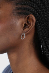 Silver flat hammered oval earrings
