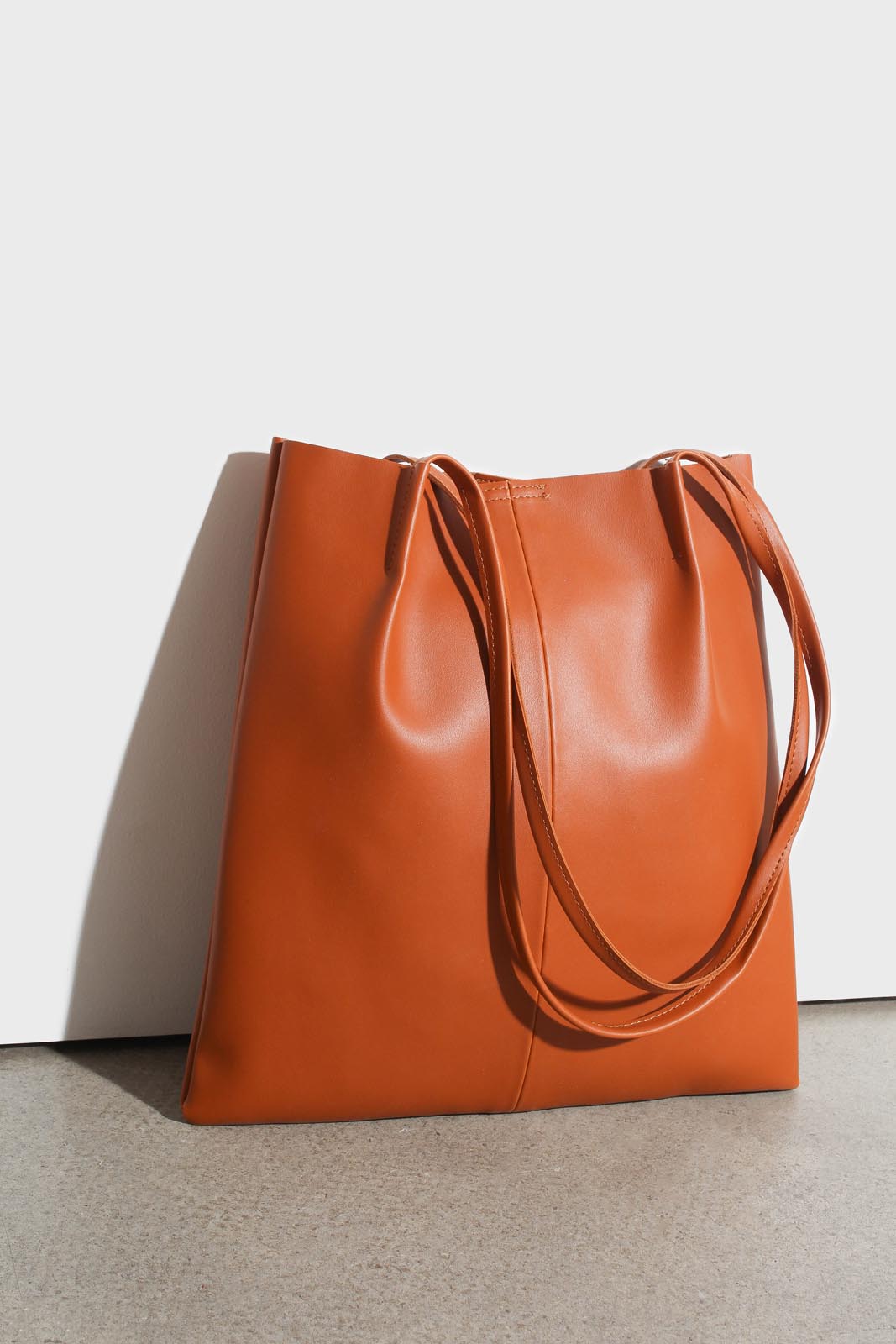 Camel vegan leather pinched strap tote bag