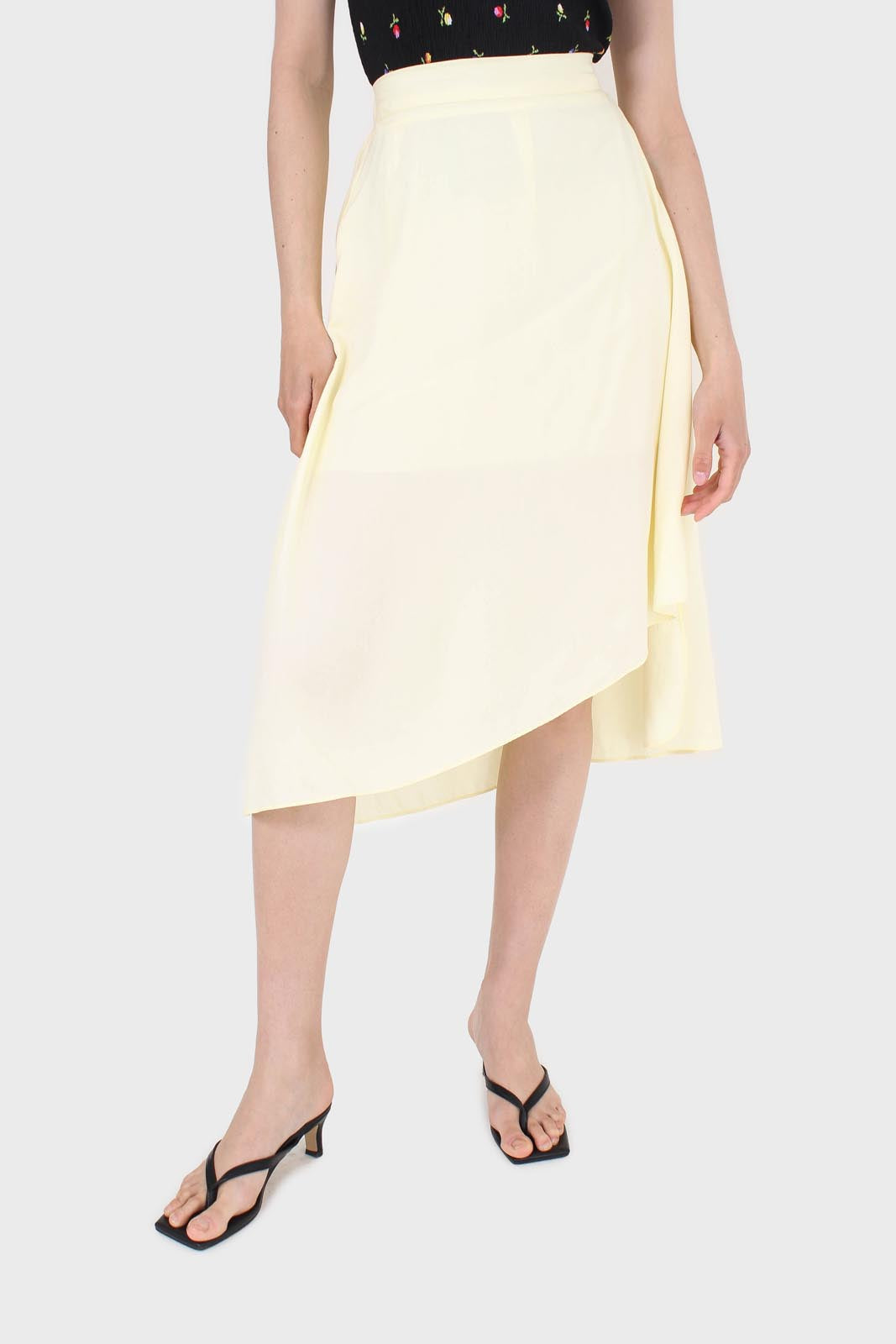 Pale yellow asymmetric hem midi skirt