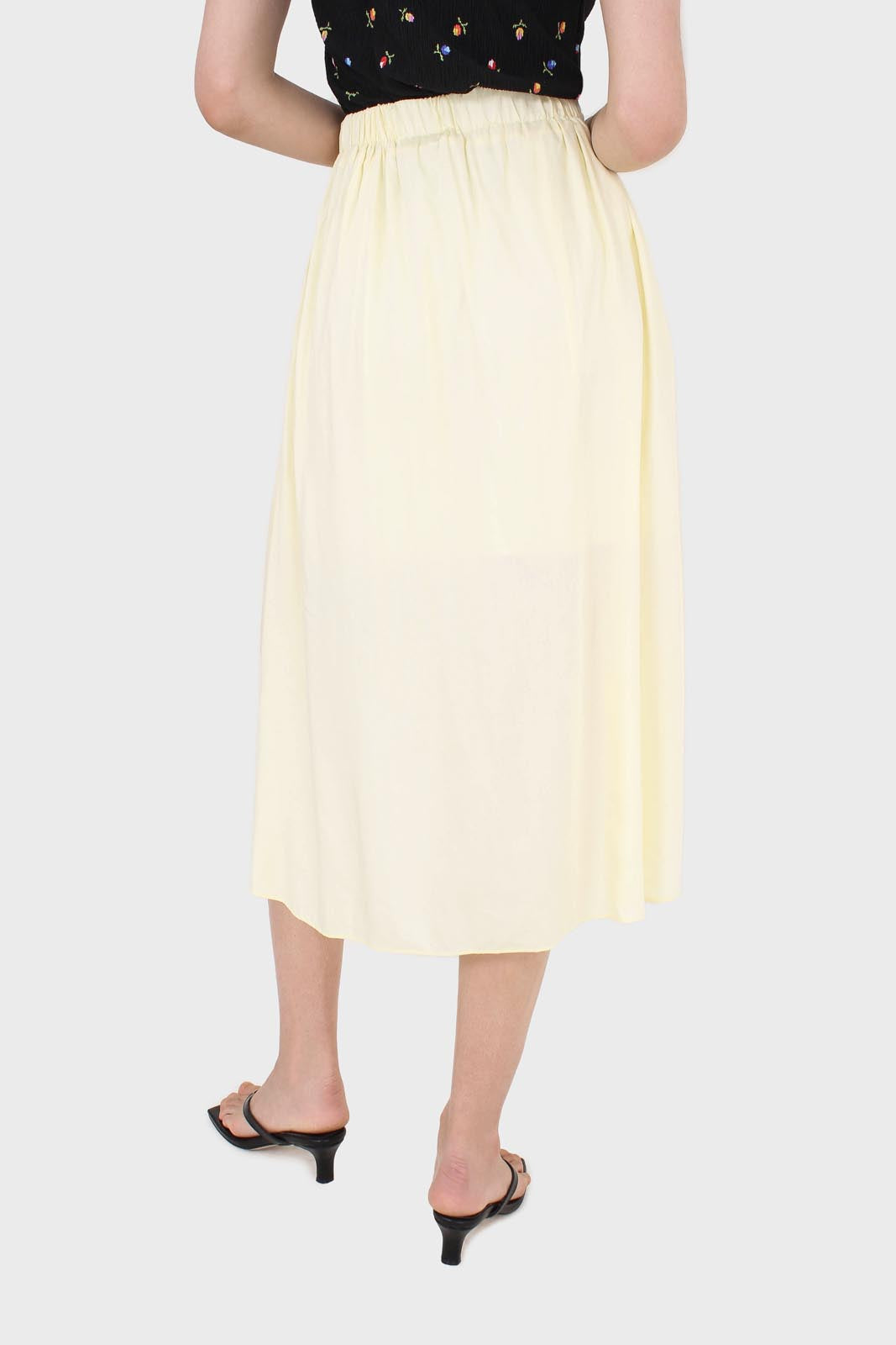 Pale yellow asymmetric hem midi skirt