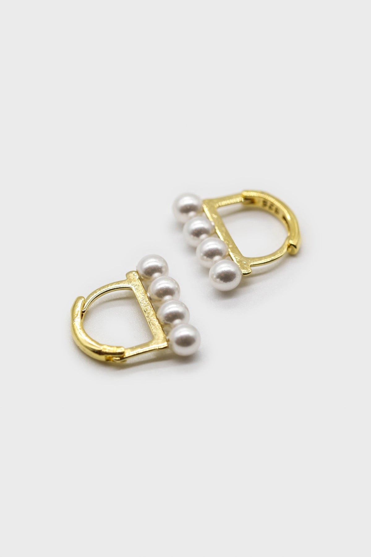 Gold small pearl D earrings