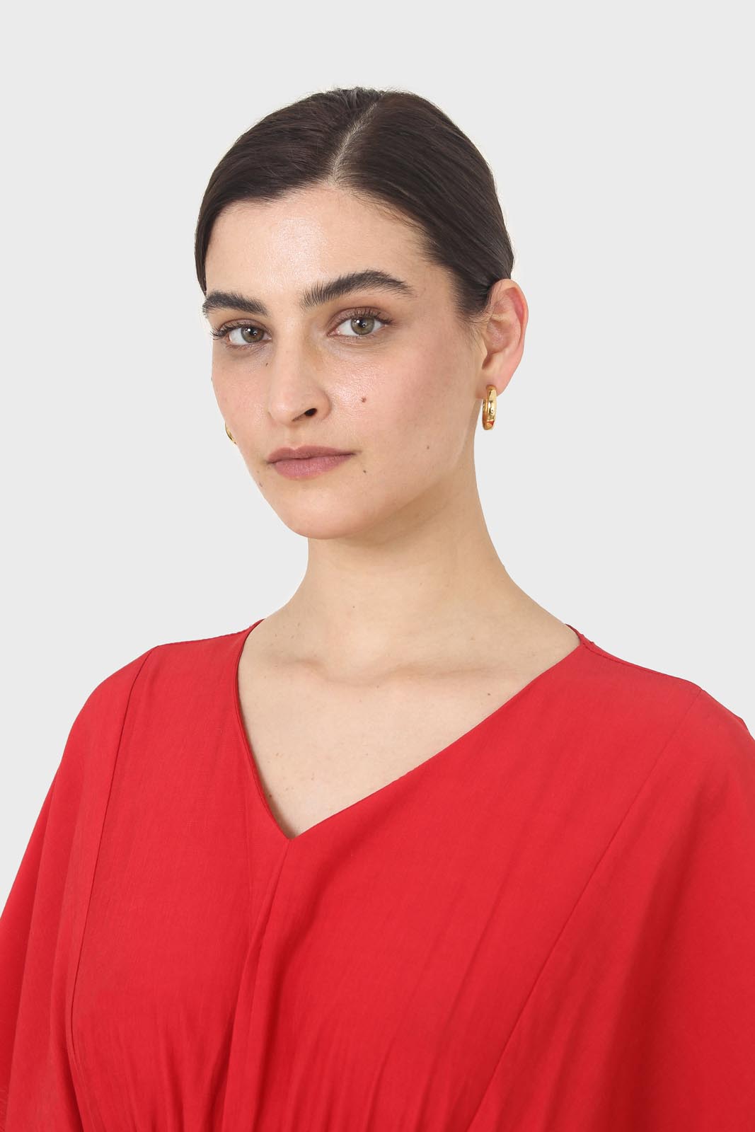 Bright red V-neck wrinkled blouse