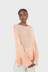 Pale orange wide neck long sleeved loose knit top