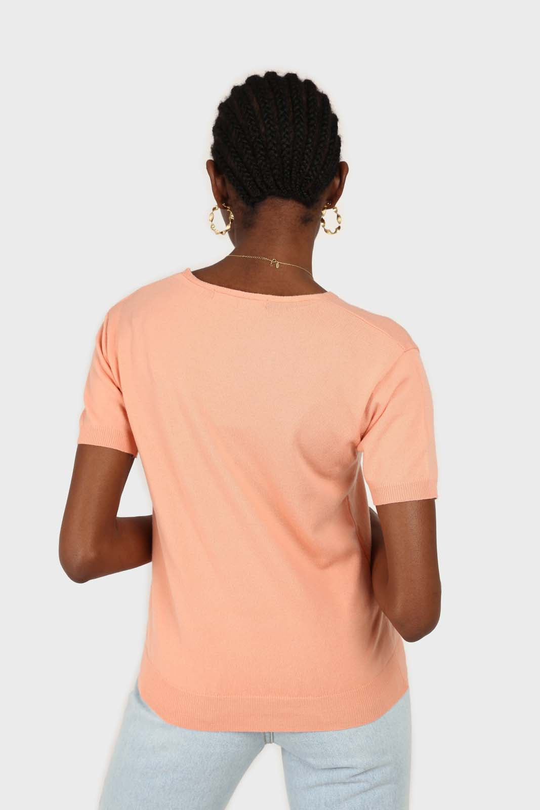 Pale orange V-neck short sleeved knit top