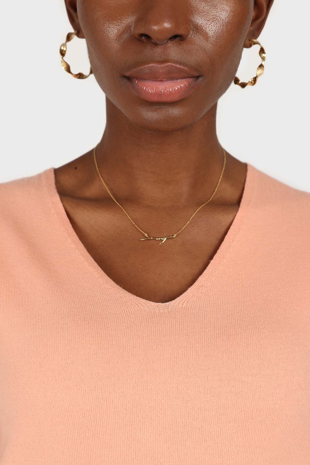 Pale orange V-neck short sleeved knit top