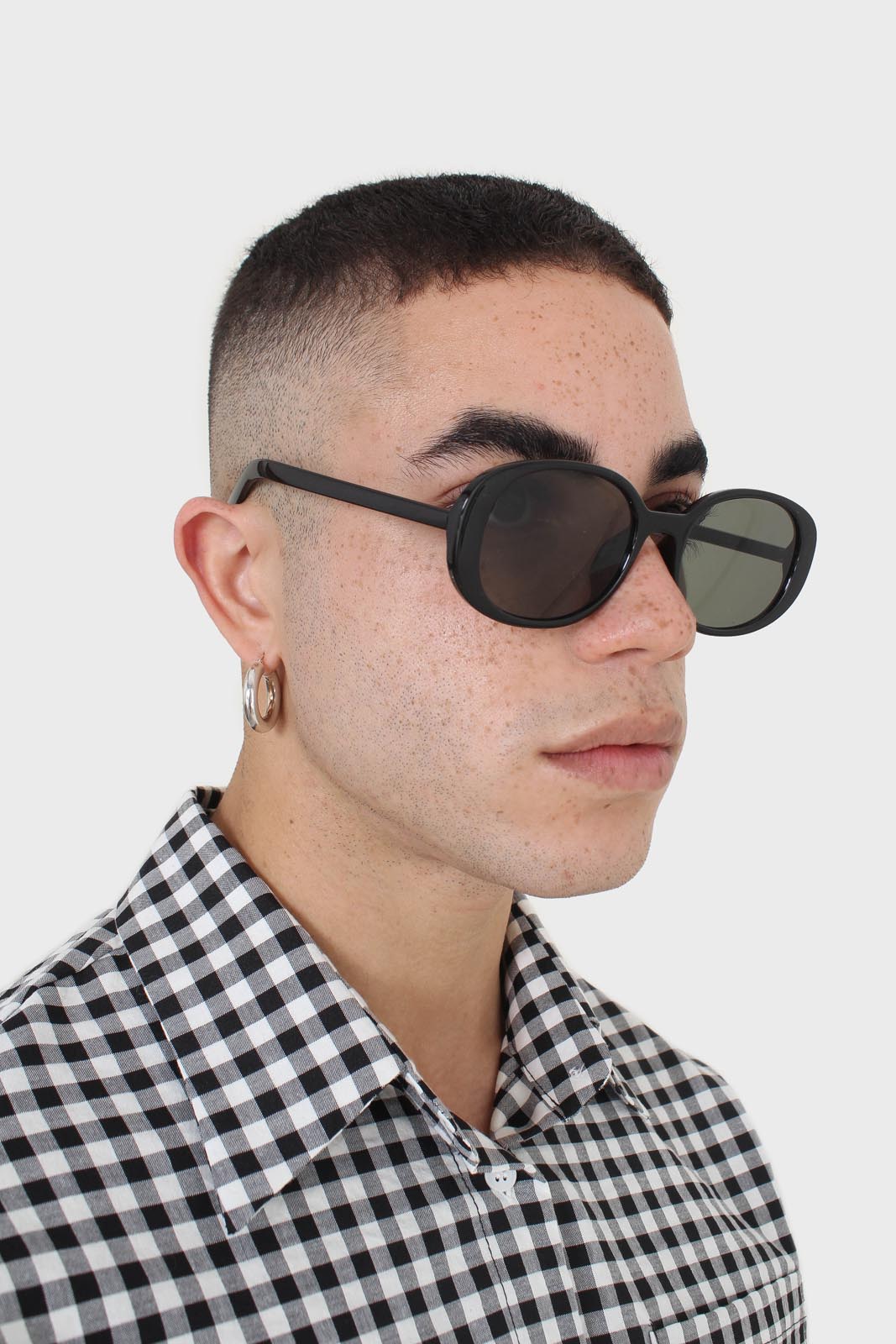 All black thick oval frame sunglasses