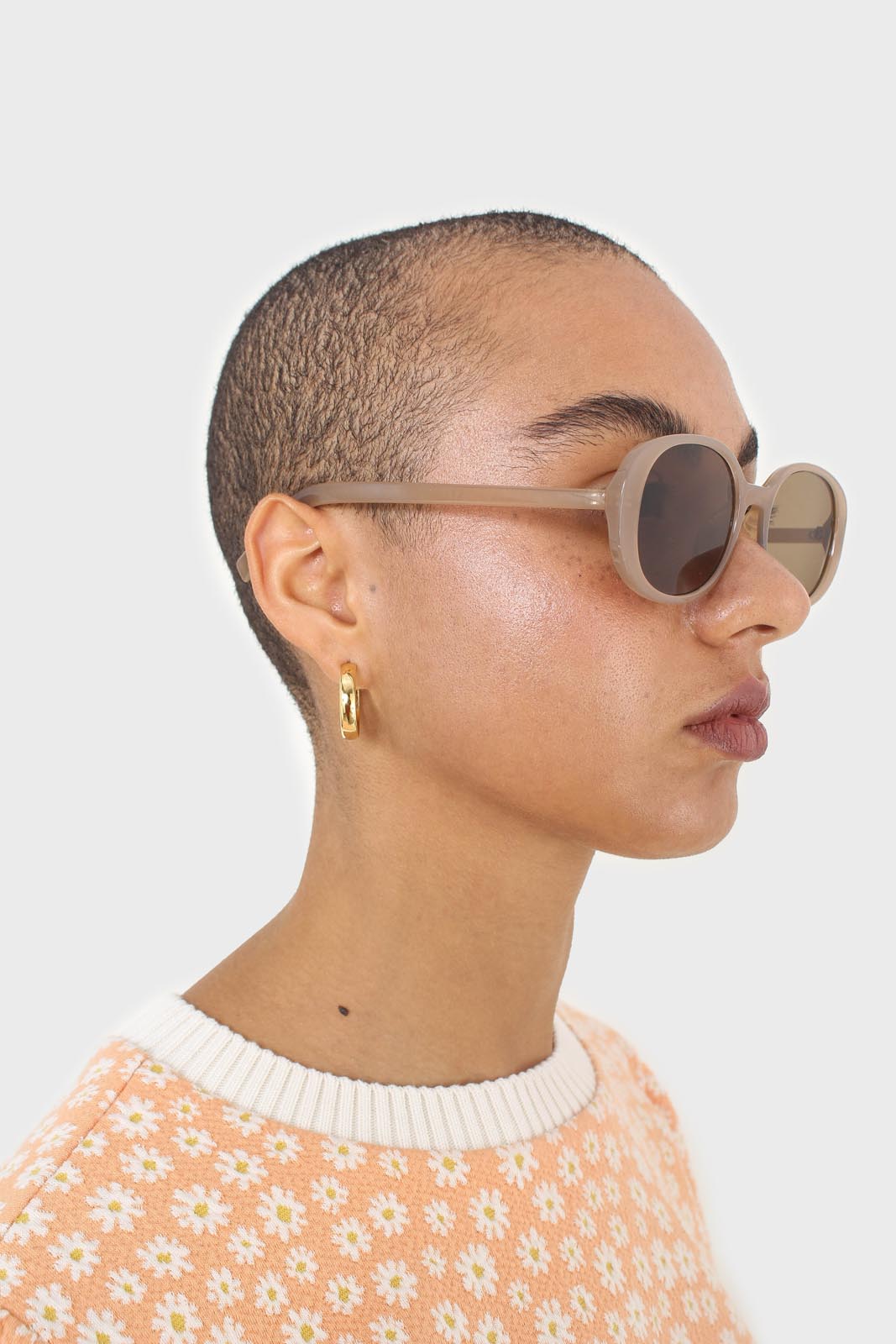 All beige thick oval frame sunglasses