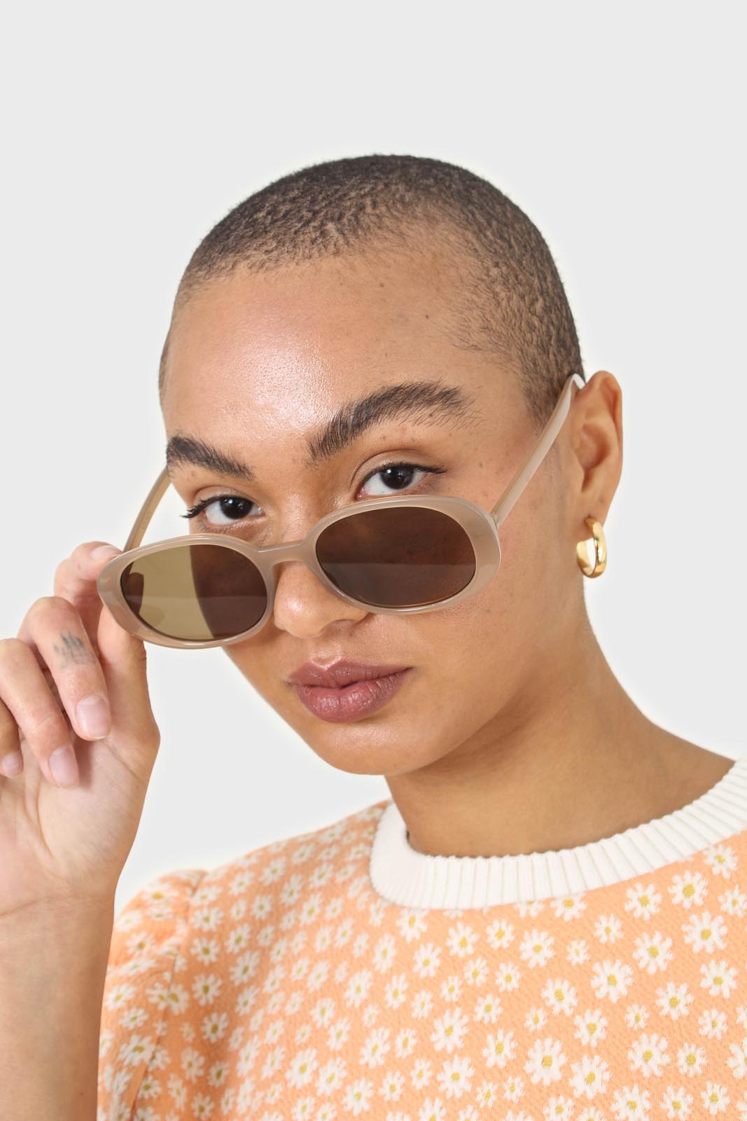 All beige thick oval frame sunglasses