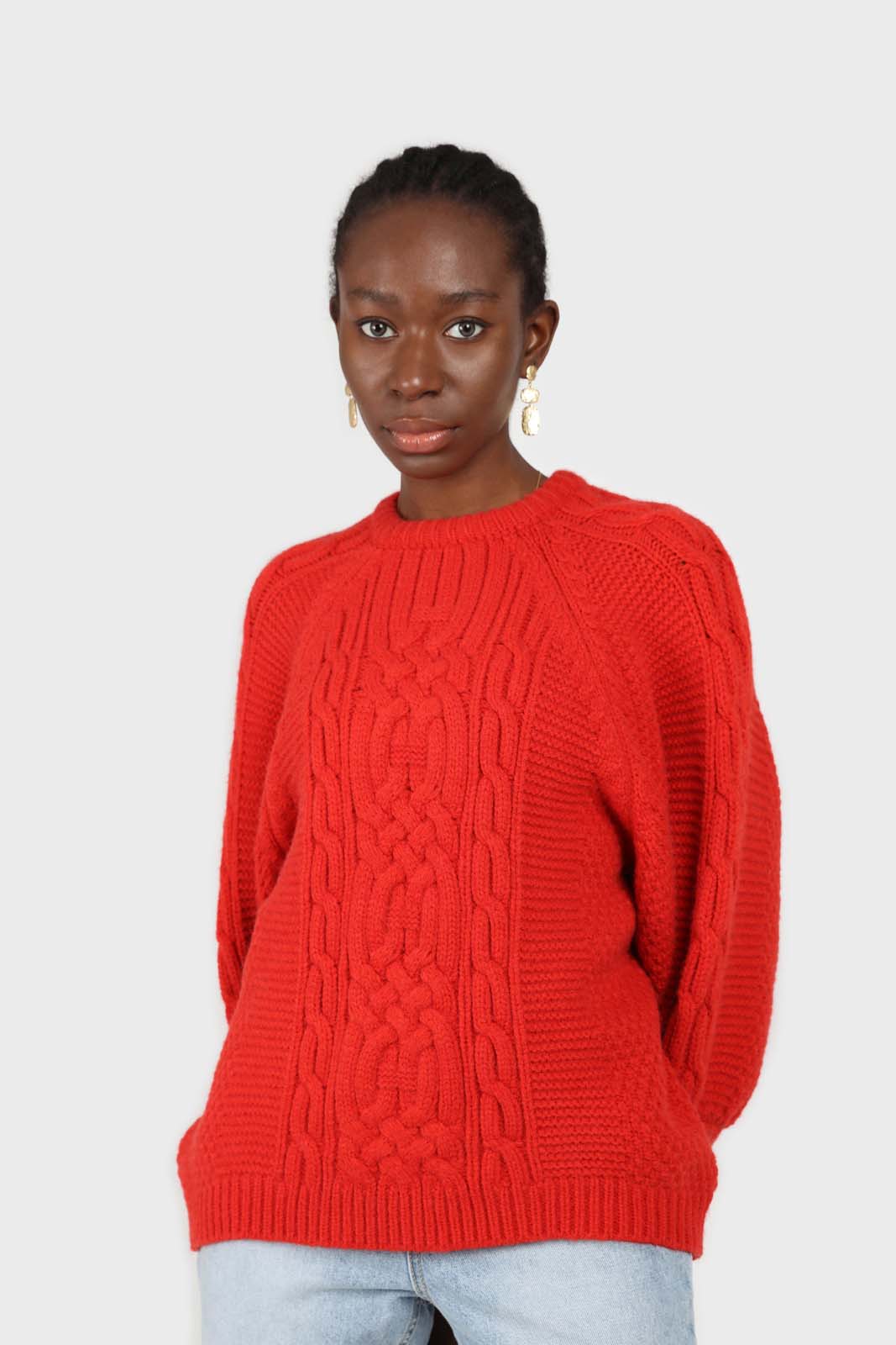 Bright red chunky cable knit balloon sleeved jumper