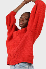 Bright red chunky cable knit balloon sleeved jumper