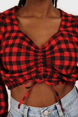 Red and black checked pull string long sleeved top