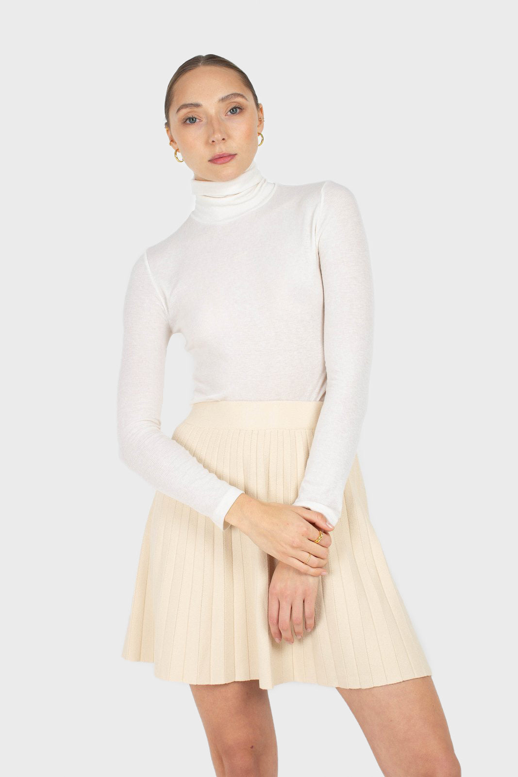 Ivory pleated knit mini skirt