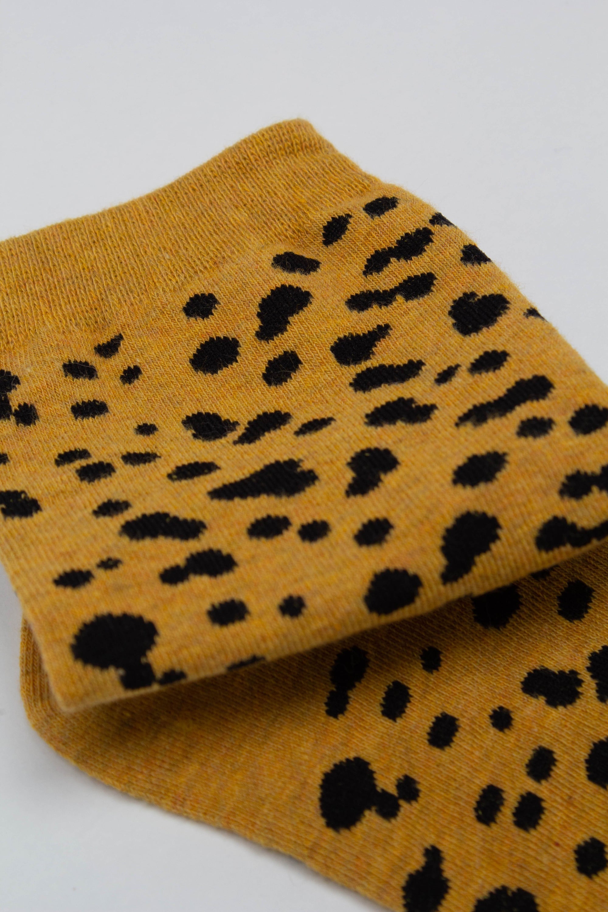 Yellow and black leopard socks