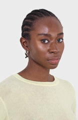 Pale yellow long sleeve jersey top