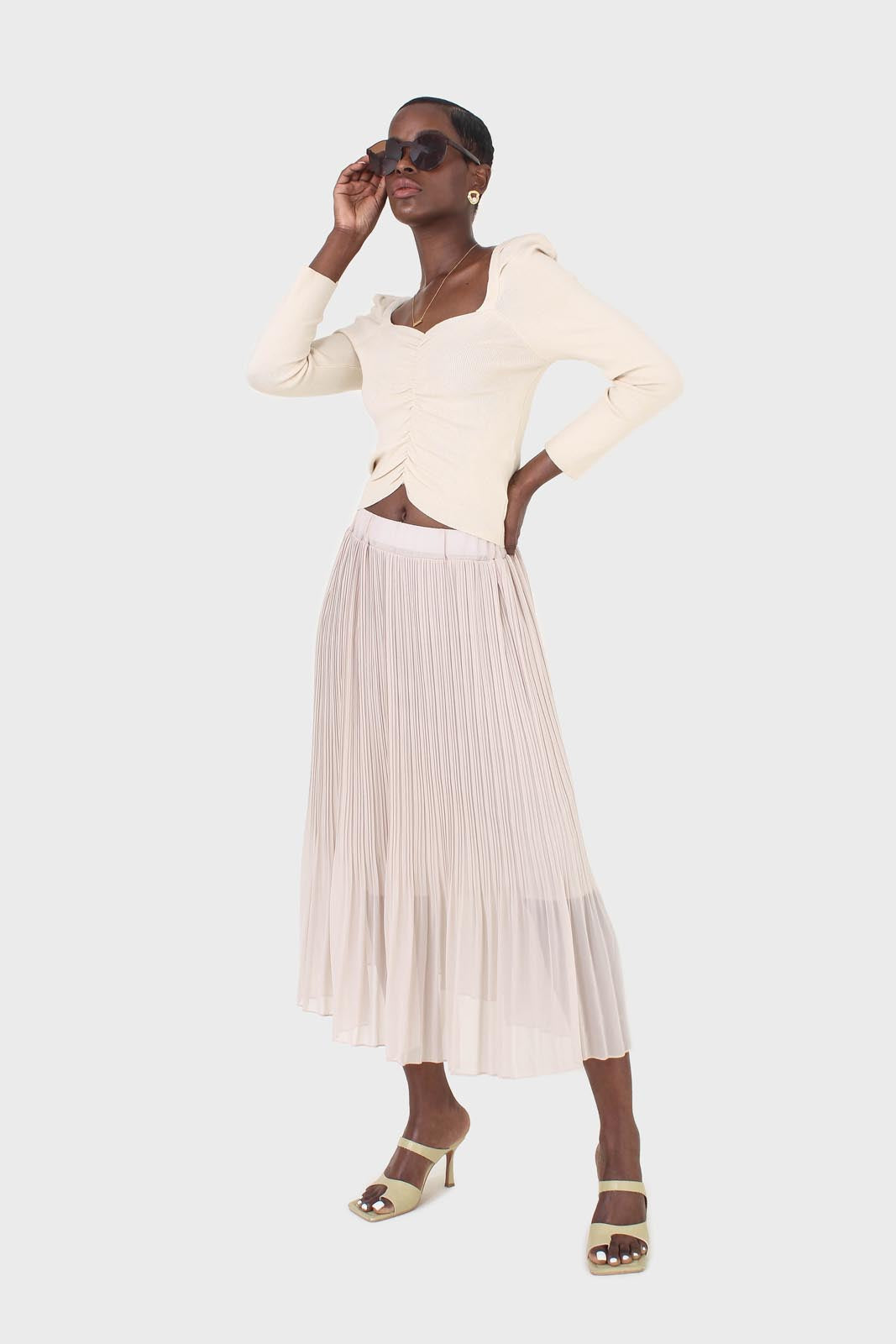 Beige gathered front long sleeved knit top