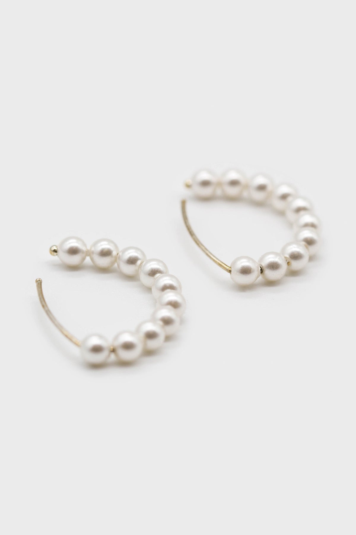 Silver pearl half hoop earrings
