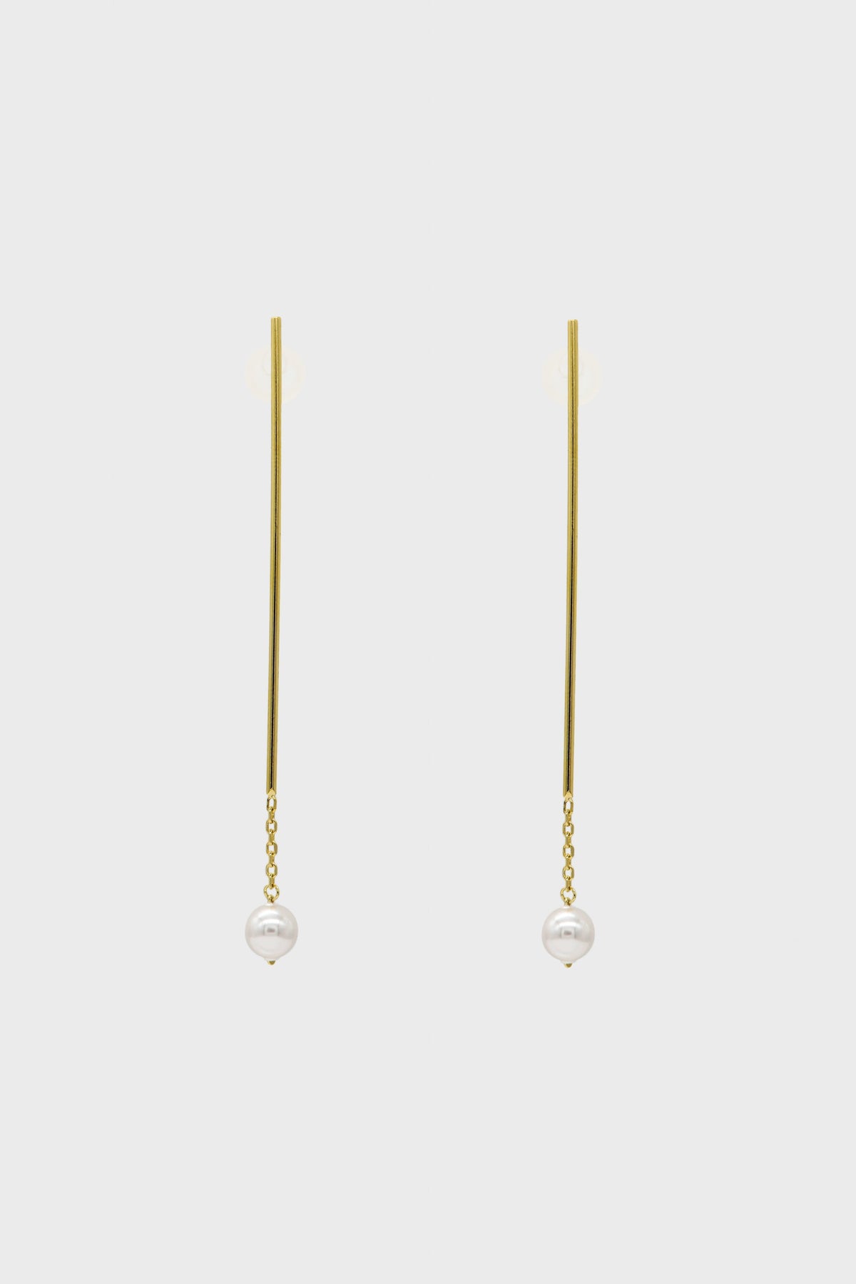 Gold long drop pearl earrings