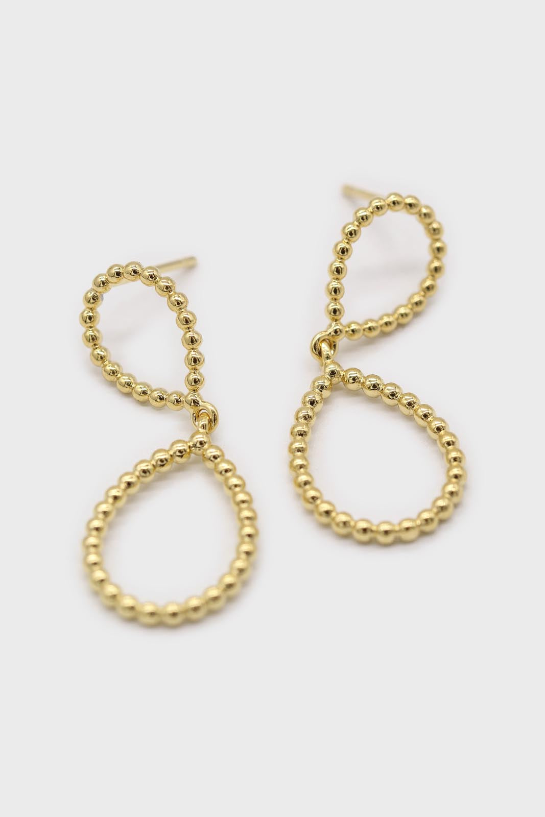 Gold pinched oval bead drop earrings