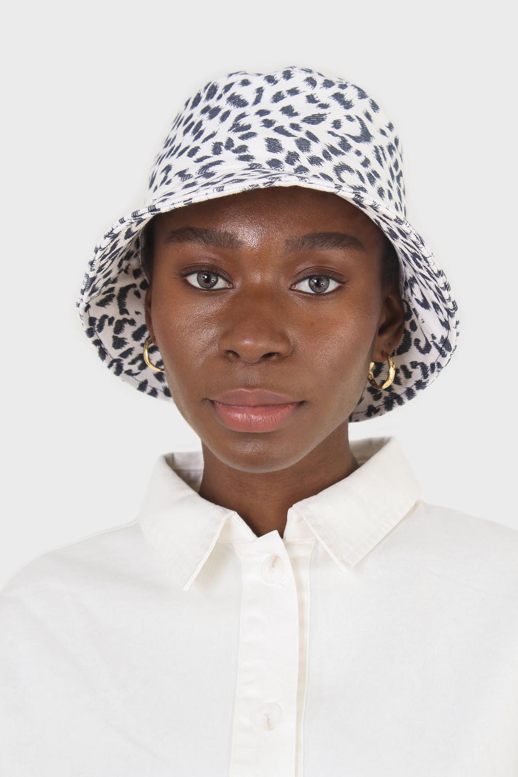 Ivory and navy leopard print bucket hat