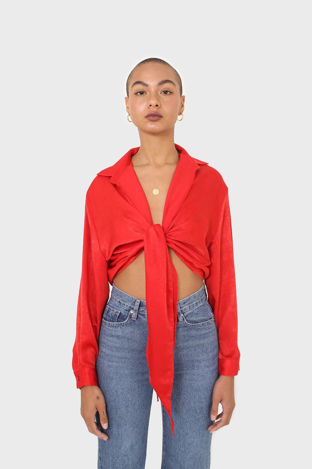 Bright red textured silky plunging tie front shirt