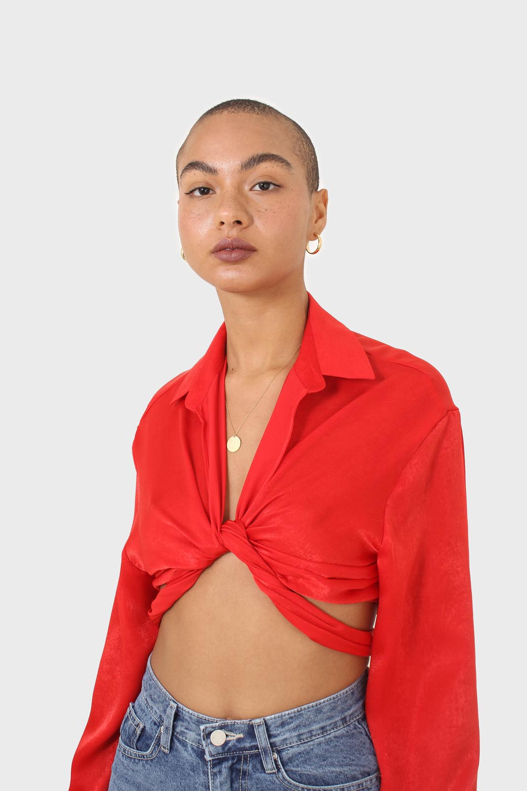 Bright red textured silky plunging tie front shirt