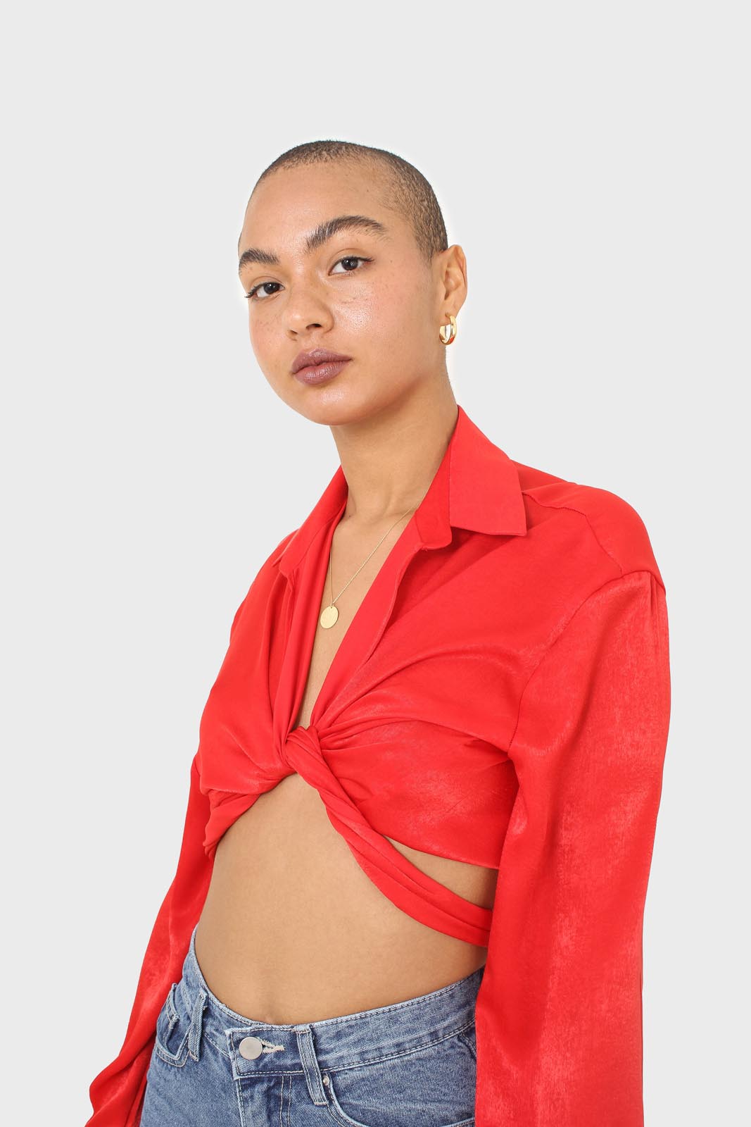 Bright red textured silky plunging tie front shirt