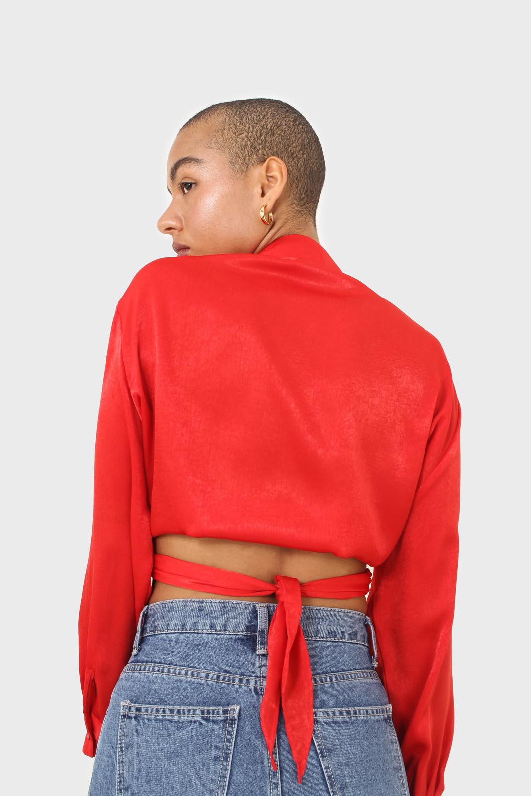 Bright red textured silky plunging tie front shirt