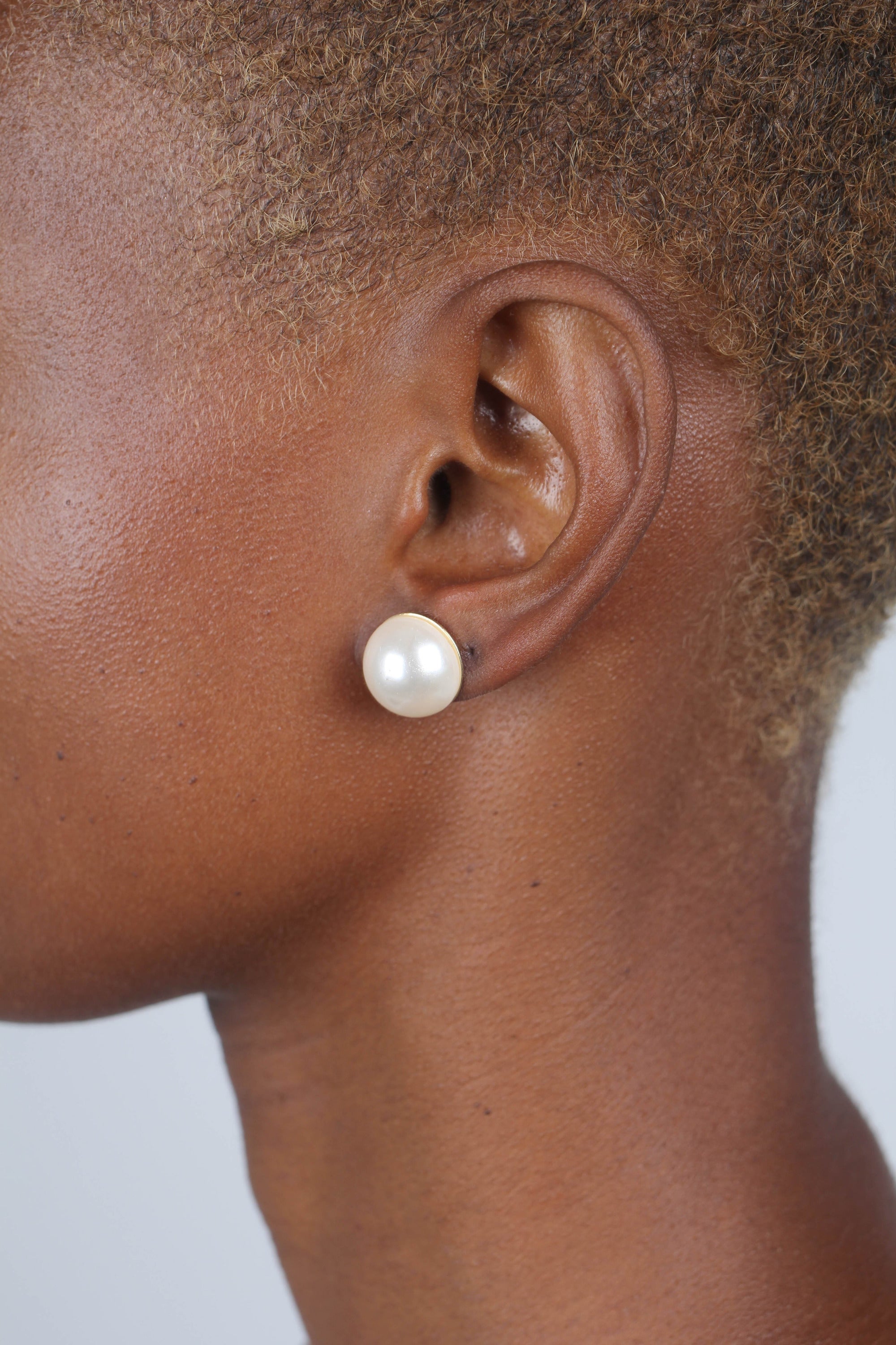 Gold giant pearl fan earrings