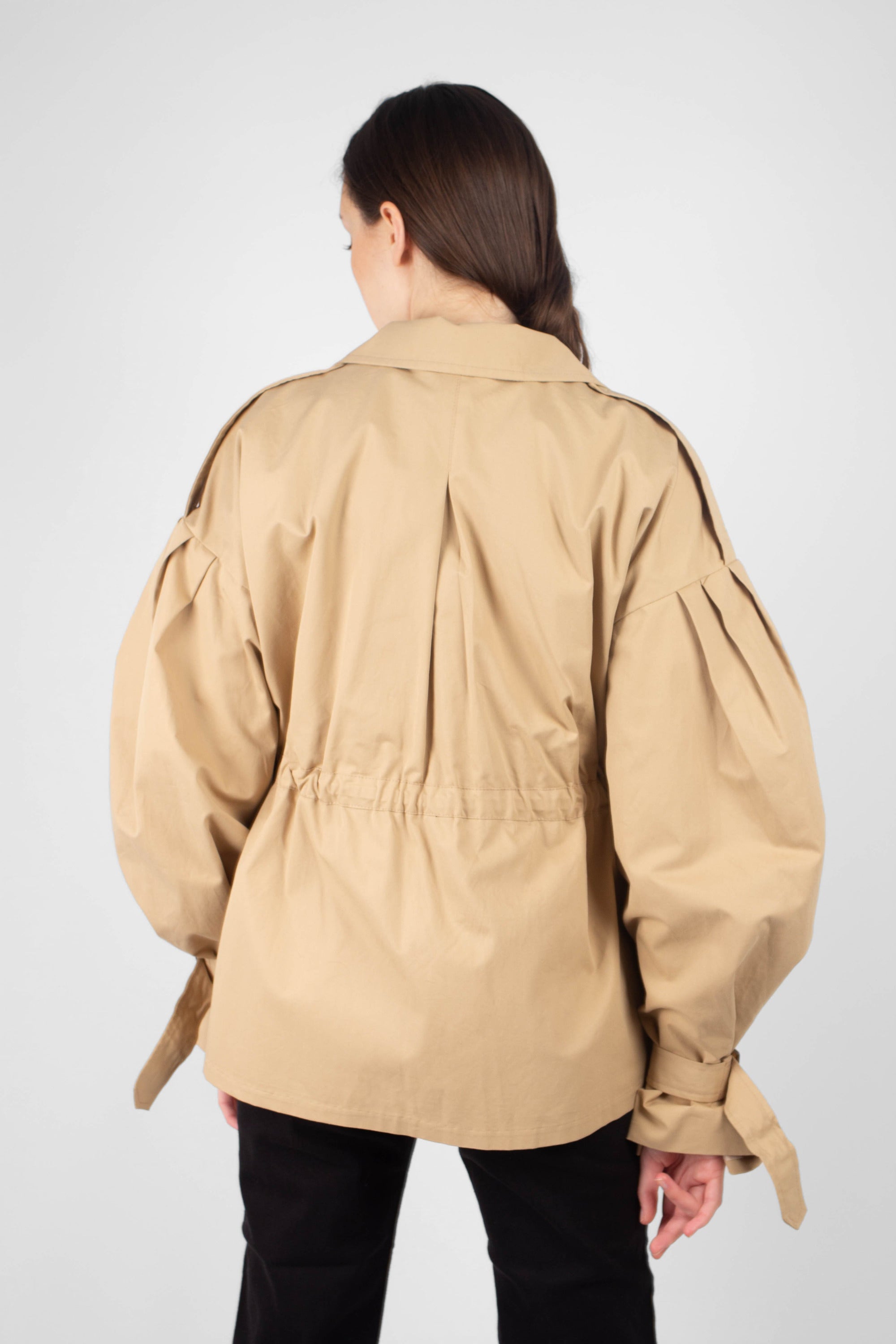 Beige double breasted half length trench coat