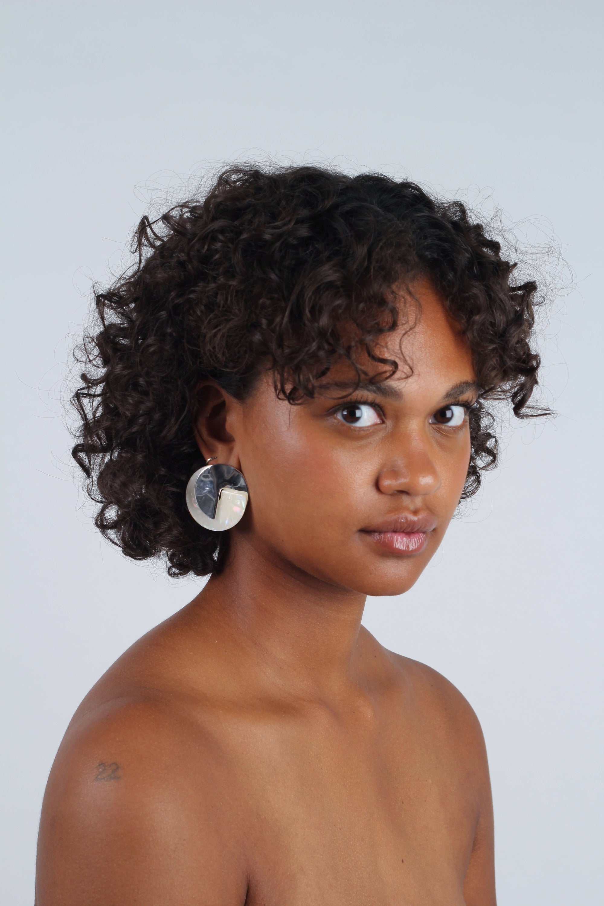 Ivory fleck and hammered silver disc earrings