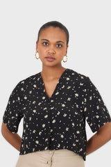 Black daisy print short sleeved blouse