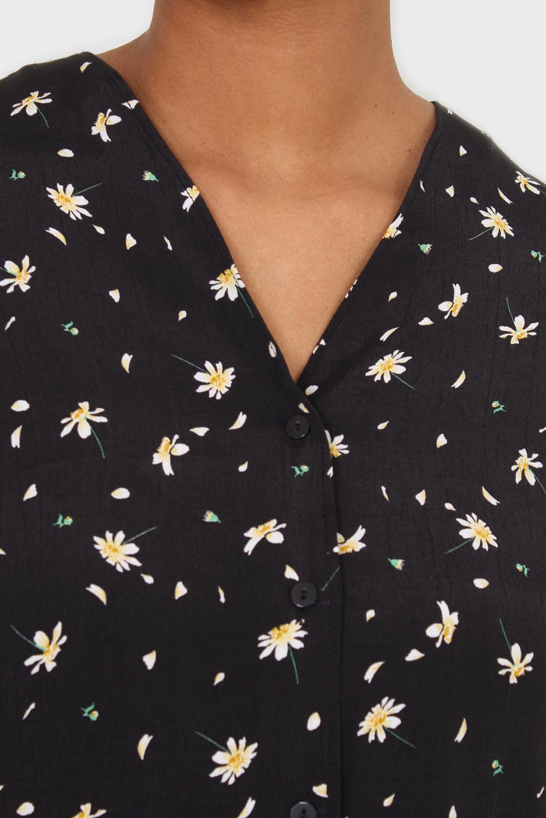 Black daisy print short sleeved blouse