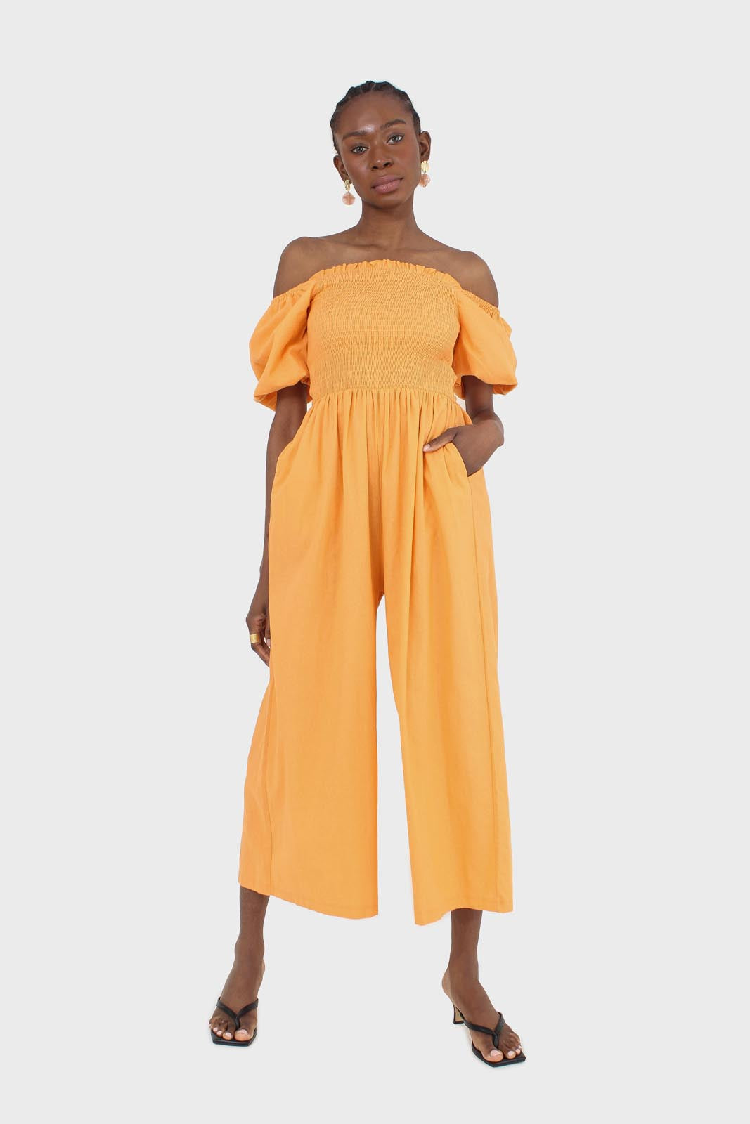 Orange short sleeved ruched bodice jumpsuit