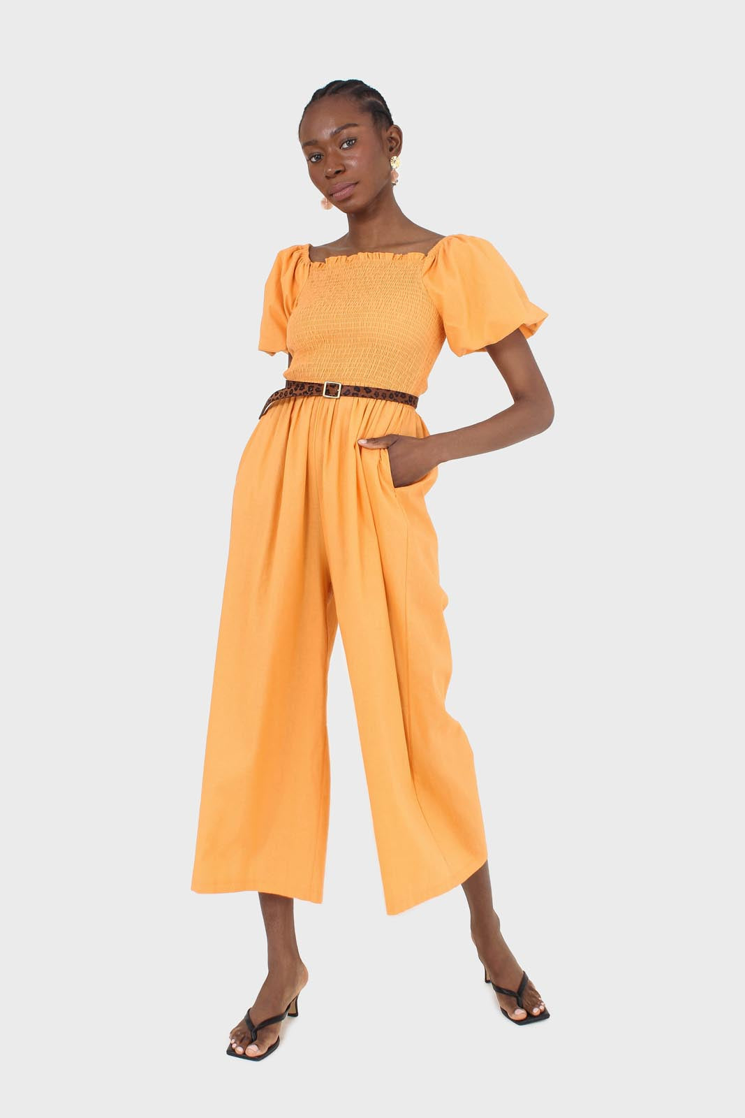 Orange short sleeved ruched bodice jumpsuit